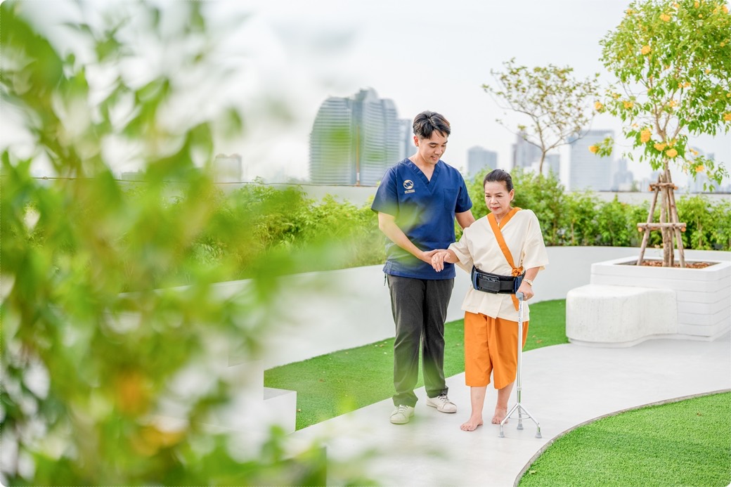 Rooftop garden walkway with the Bangkok skyline behind